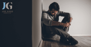 Man sitting on floor in the corner DUI Lawyer Charleston, SC